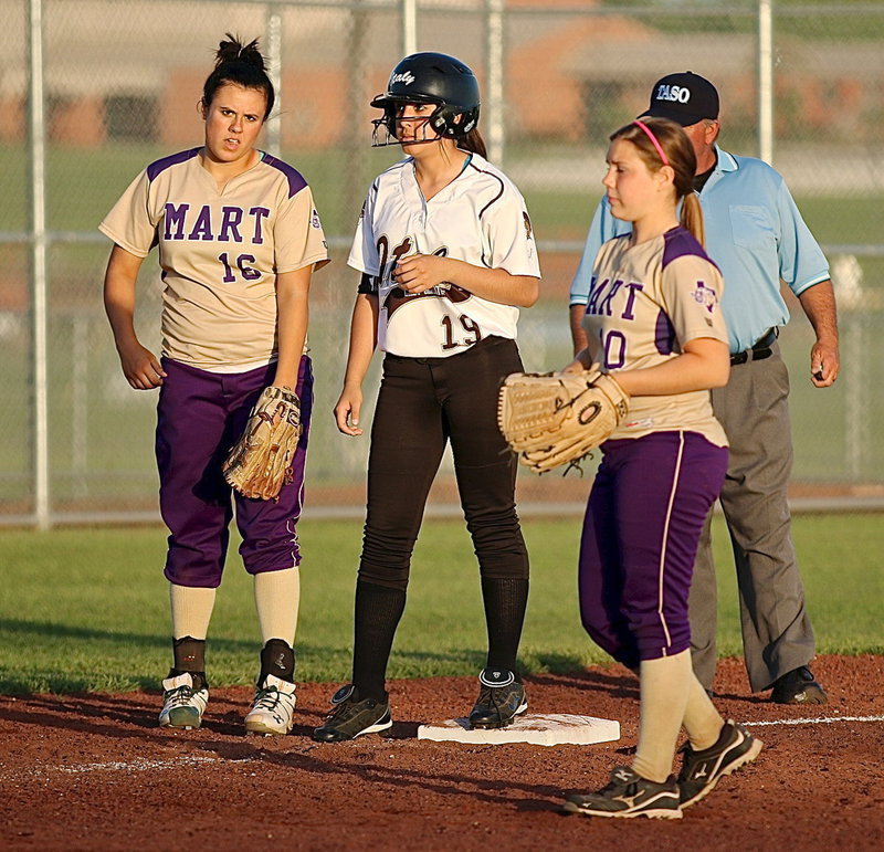 Image: Pinch runner Lizzie Garcia(19) is surrounded by Lady Panthers at third-base.