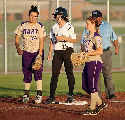Image: Pinch runner Lizzie Garcia(19) is surrounded by Lady Panthers at third-base.