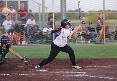 Image: Paige Westbrook(10) singles to put two runners on base for the Lady Gladiators.
