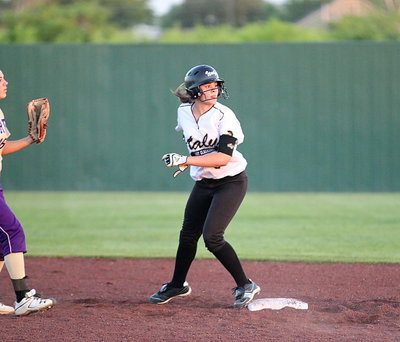 Image: Lillie Perry(9) reaches second-base and then locates the ball in hopes of going to third.