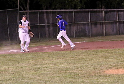 Image: Gladiator third-baseman John Byers(18) ends any hopes for a Frost rally when he fields a grounder, steps on the bag for the force out and then throws across the infield for the final out at first-base. A double-play!