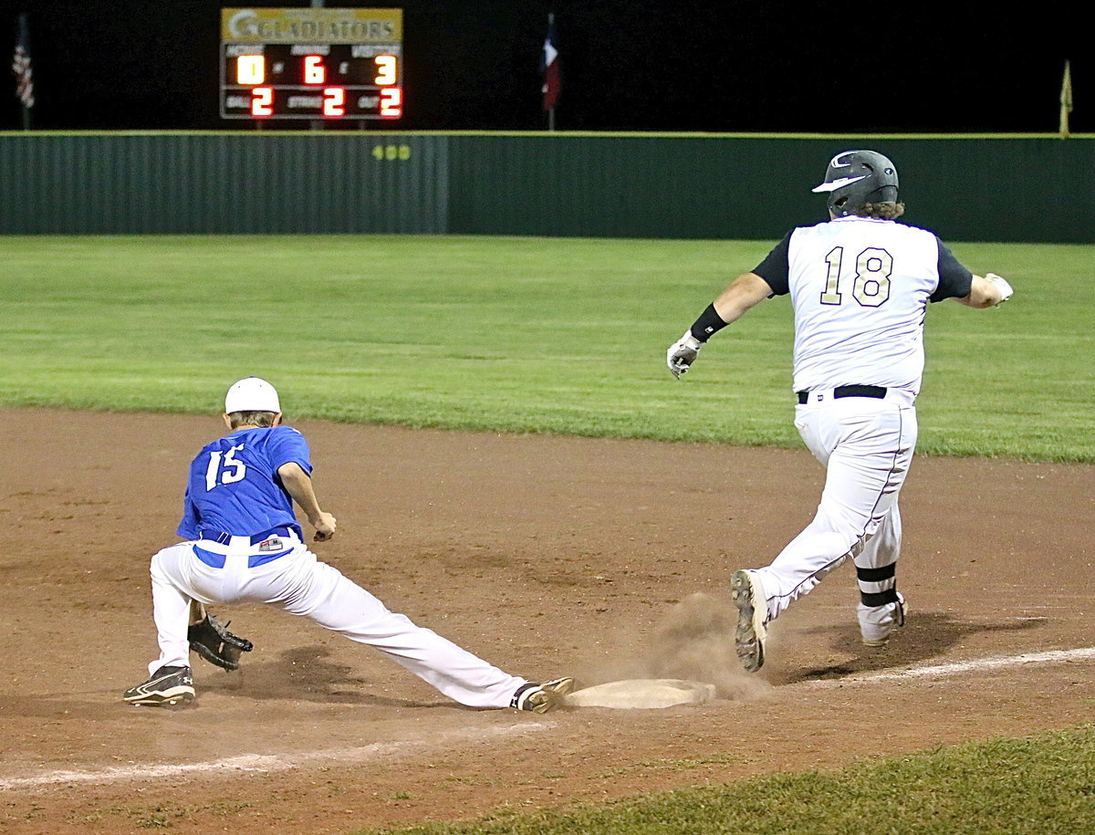 Image: Itay’s John Byers(18) beats the attempted throw to first-base with Frost unable to stop him.