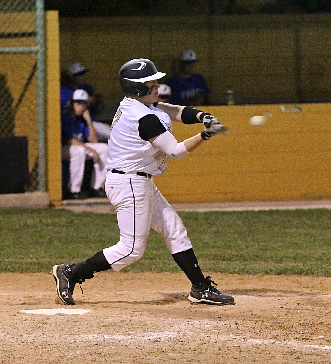 Image: “Kablam!” That’s the sound fans heard when this blurring blast from John Escamilla(7) smacked the left field wall at the 235 foot mark. The jolt resulted in a double for the junior who has maintained a reliable bat during Italy’s district championship run.