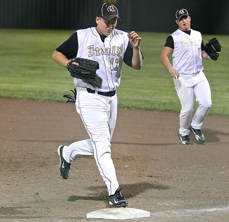 Image: Bailey Walton(17) fields a ground ball and then scuttles over to step on his first-base bag for the out. Fellow senior Zain Byers(5) backs up the play.