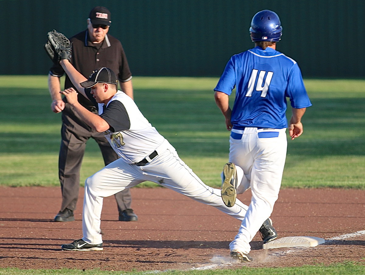 Image: Senior Gladiator first-baseman, Bailey Walton clutches the ball to get an out against Frost.