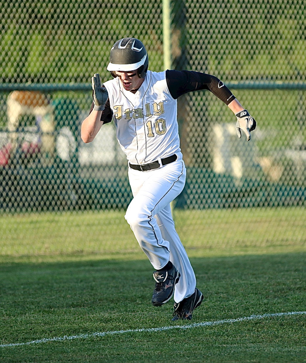 Image: Cody Boyd(10) races home to score a run for the Gladiators.