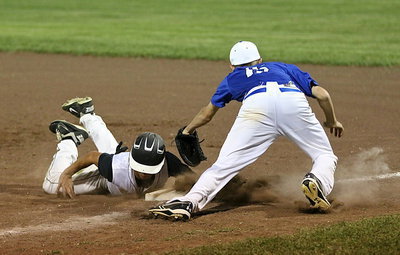 Image: Levi McBride(1) dives back to first but then takes second-base thanks to a poor throw.