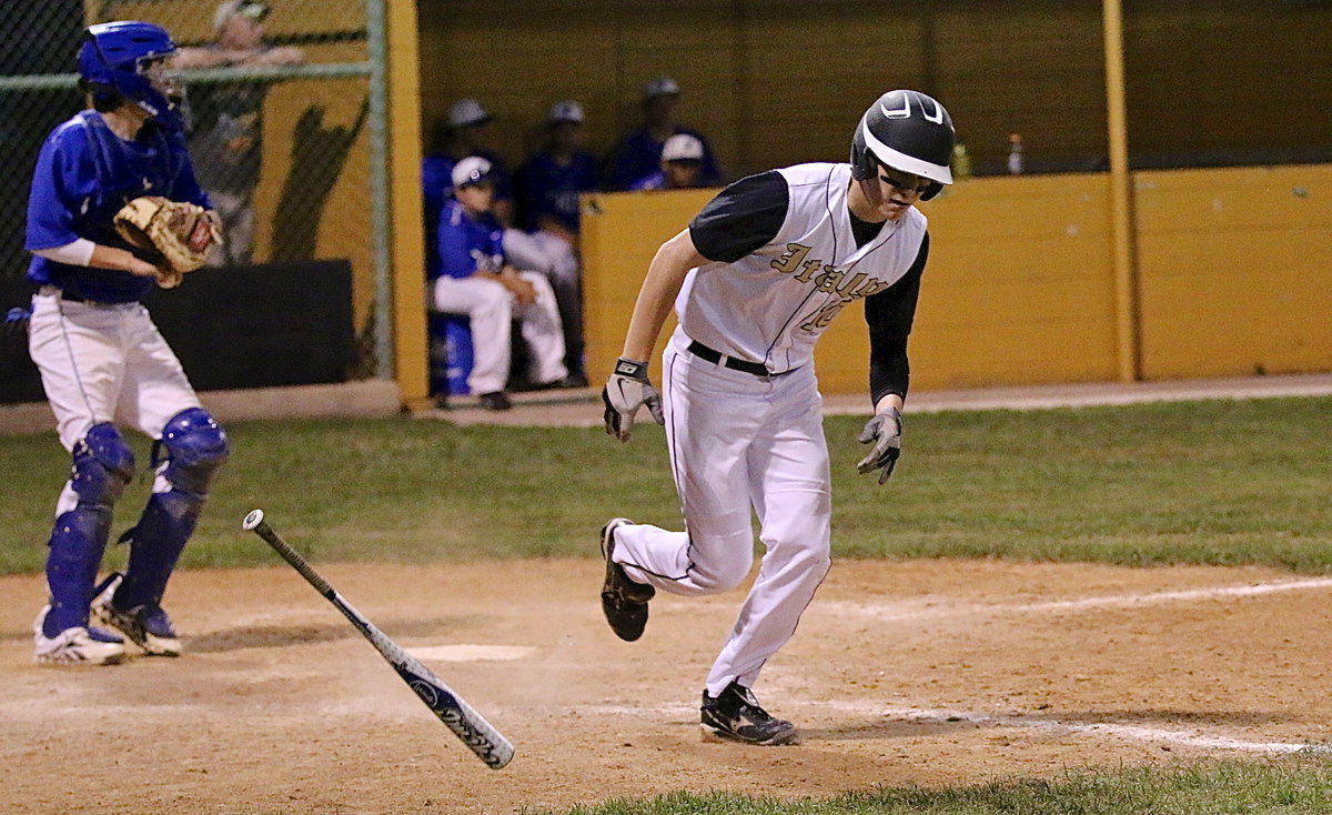 Image: Cody Boyd(10) battles his way to a walk for the Gladiators.