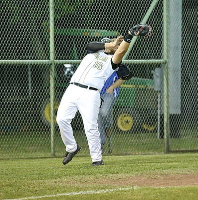 Image: Kevin Roldan(16) gets under a popup in foul territory to secure an out.