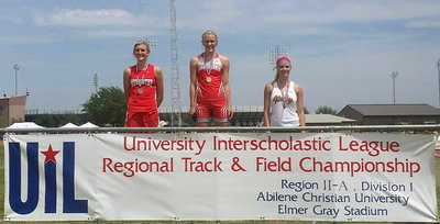 Image: Italy Lady Gladiator sophomore Halee Turner (Right) is presented her bronze medal in high hurdles after posting a 3rd Place time of 15.90 during the UIL Regional Track And Field Championship in Abilene at the Abilene Christian University campus.