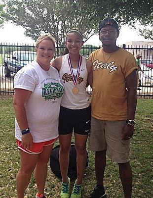 Image: Italy Lady Gladiator freshman April Lusk with her proud parents Amanda and Darrin Lusk after Lusk earned a gold medal with her sprint relay team during the UIL Regional Track And Field Championship in Abilene at the Abilene Christian University campus.