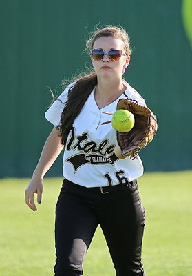 Image: Lady Gladiator Amber Hooker(16) warms up with the outfielders.