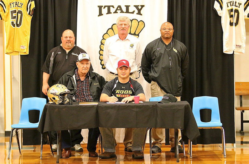 Image: Members of the Italy Gladiator Football coaching staff are on hand as Zain Byers signs his commitment letter to play football for Austin College. Back row (L-R): Wayne Rowe, AD/HFC Charles Tindol and Bobby Campbell. Front row (L-R): honorary team coach Richard Cook and the man of the hour, Zain Byers.
