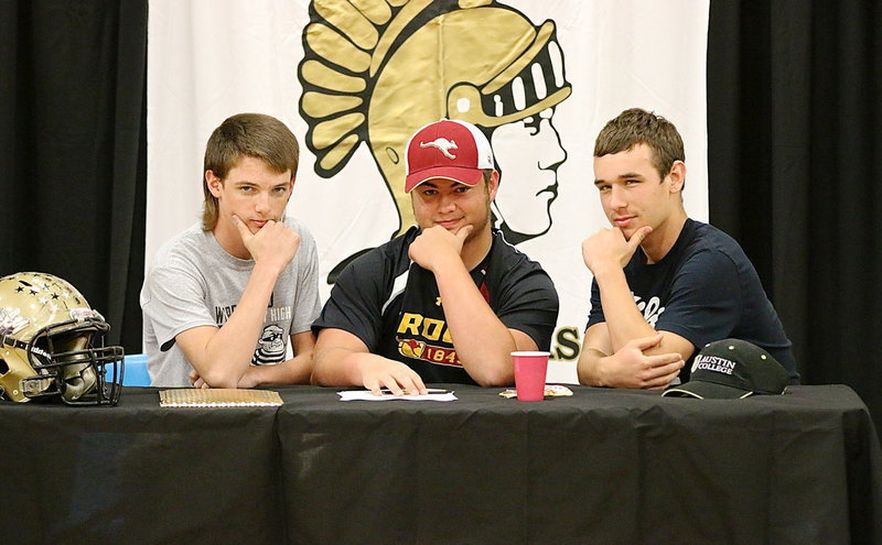 Image: Who let the ’Roos out? Ty Windham and Ryan Connor strike a pose with Gladiator teammate Zain Byers after Byers signed his commitment letter to play football for the Kangaroos. I guess the real question here is, “Can Austin College survive?”