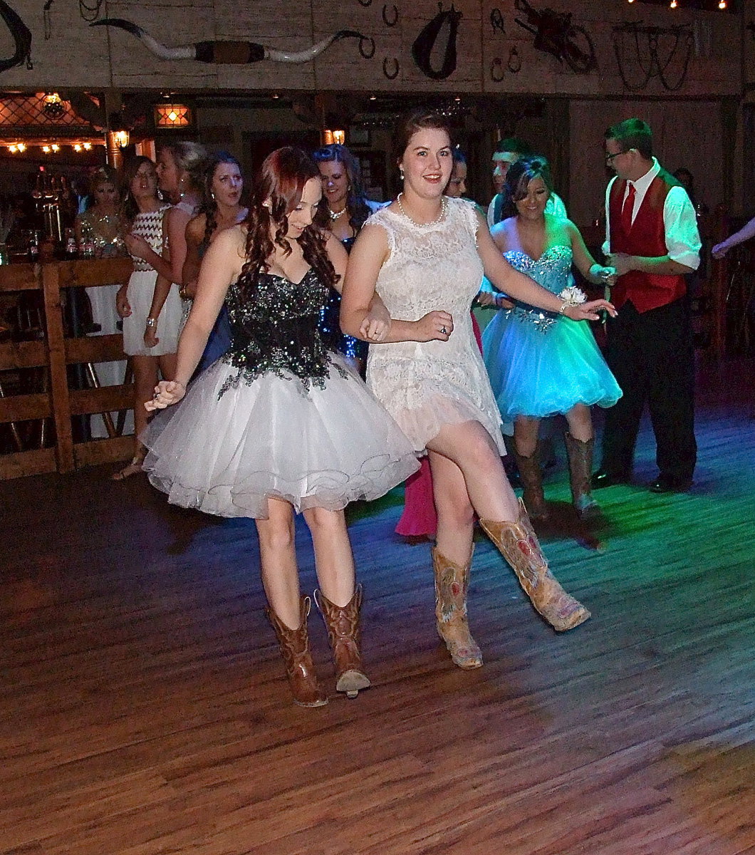 Image: Kara Dale and Taylor Turner kick up some sawdust to the Cotton-Eyed Joe.