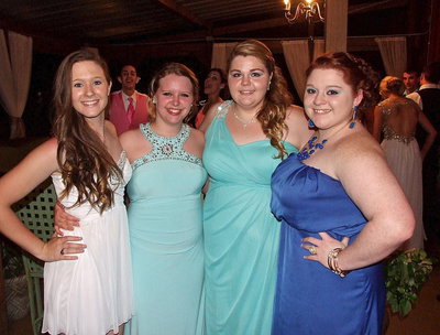 Image: Aspen Jade Eaglan, Tia Russell, Taylor Perry and Meagan Laymance are all dressed up with a prom to go to.