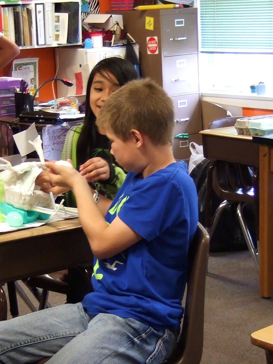 Image: Jordan Luna  and Tanner Chambers are hard at work putting their egg in its  hand made armor.