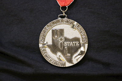 Image: A closeup one of the UIL state medals secured by Italy Track and Field members during their state competition held at the University of Texas in Austin.