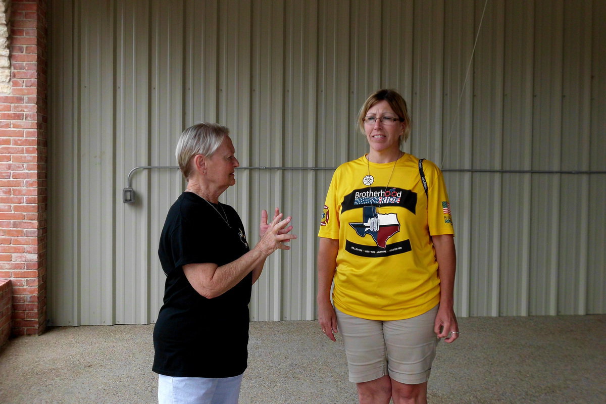 Image: Carla Pickard talked to Candy Morse, Secretary of the Brotherhood Riders.