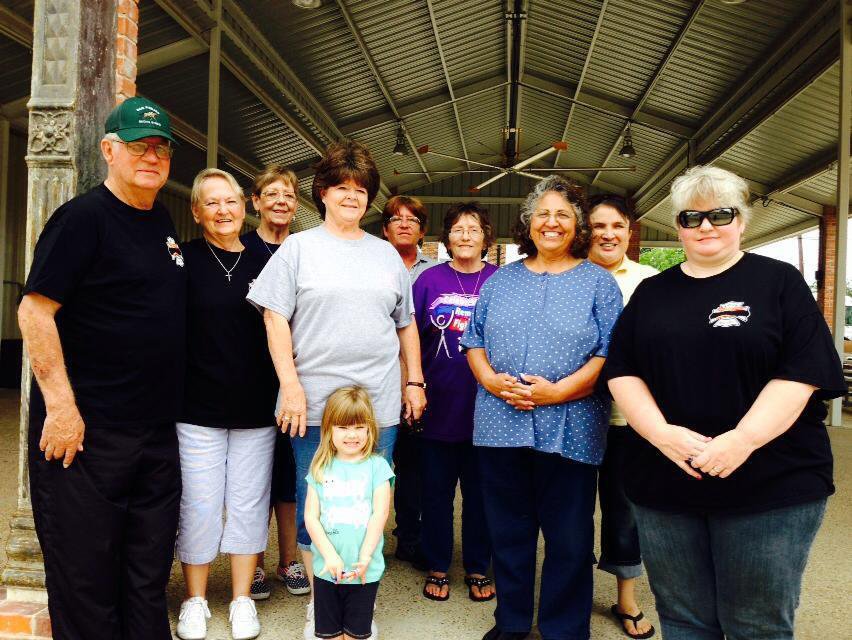 Image: Several Italy residents help the Pickards welcome the riders to town.