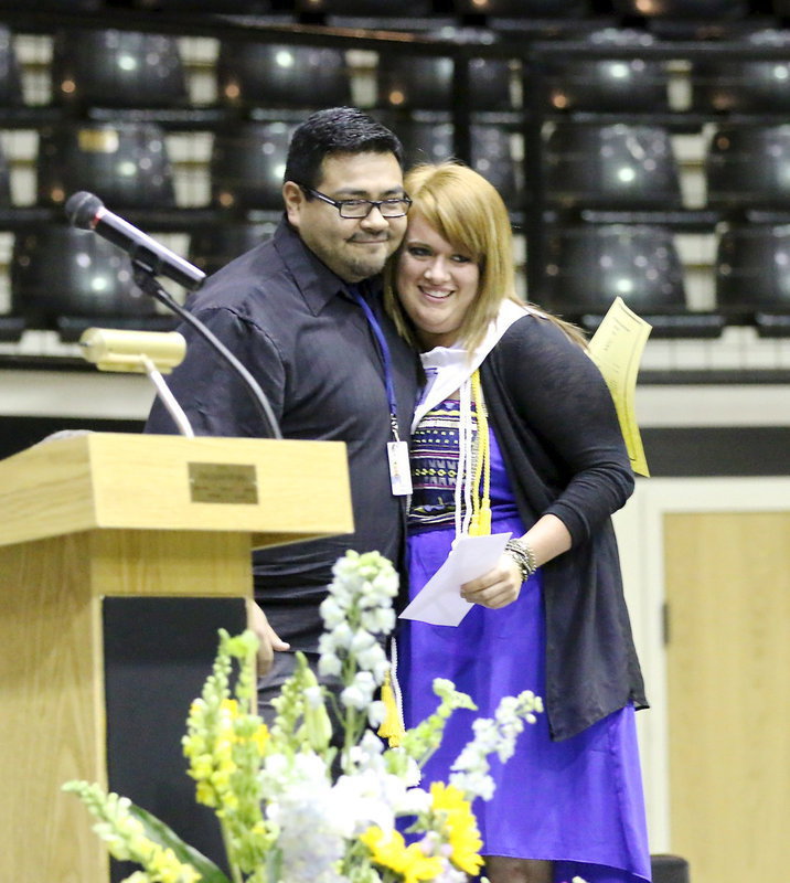 Image: Jesus Perez presents one of the Italy High School Band Booster Scholarships to Emily Stiles.