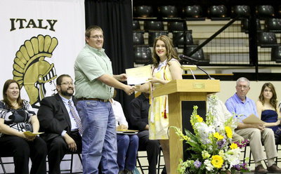 Image: Blake Godwin presents Taylor Turner with the Italy Youth Buyers Scholarship.