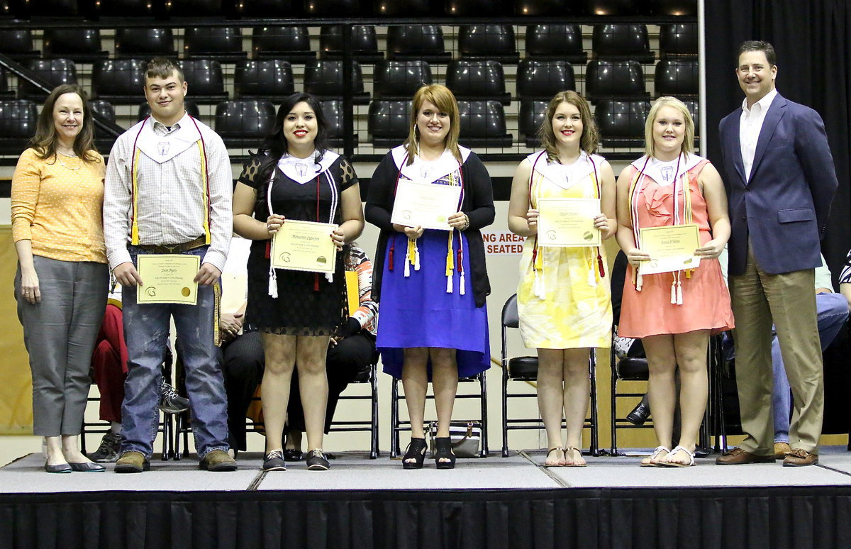 Image: During the 2014 Senior Scholarship and Award Program, Italy ISD George E. Scott Memorial Scholarships were awarded to Zain Byers, Monserrat Figueroa, Emily Stiles, Taylor Turner and Jesica Wilkins. Presenting the scholarships were Mr. Scott’s daughter, Diana Herrin (far left), and son, Tom Scott (far right), both graduates of Italy High school themselves. Each student receives $500 per semester throughout college.