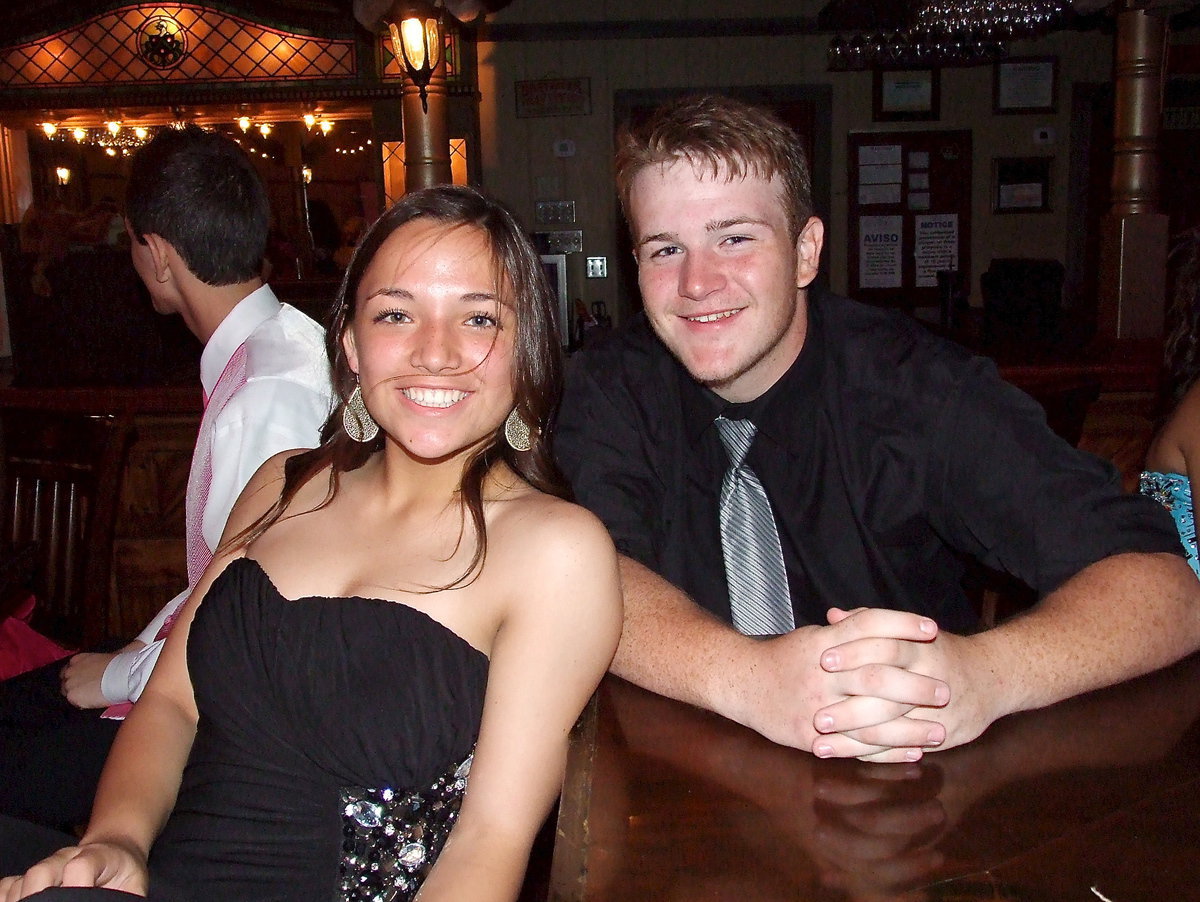 Image: Italy junior Tyler Vencill and his date Riley Mellen from Red Oak take a break from flying around the dance floor during Italy High School’s 2014 Prom Night at E’s Southern Pass in Ennis.