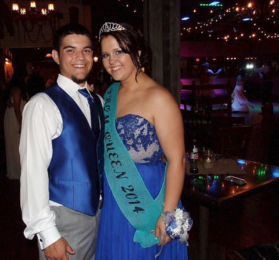 Image: Tyler Anderson with his prom date Paige Westbrook, aka ‘her majesty,’ take a break from the dance floor.