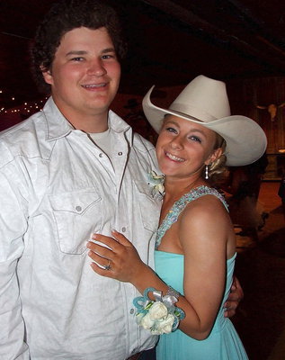 Image: John Byers, his prom date Britney Chambers and a cowboy hat.
