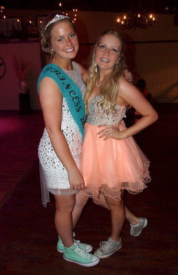Image: Sisters with silly prom shoes and dazzling smiles are Madison Washington and Hannah Washington.