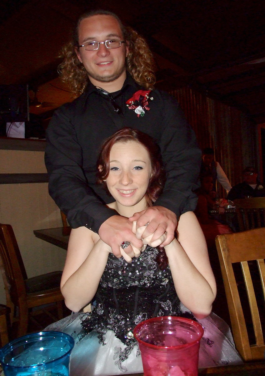 Image: Shadrach Newman and his date Kara Dale pose for a prom picture.