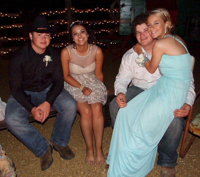 Image: Zain Byers, Ashlyn Jacinto, John Byers and Britney Chambers huddle around a campfire outside the dance hall.