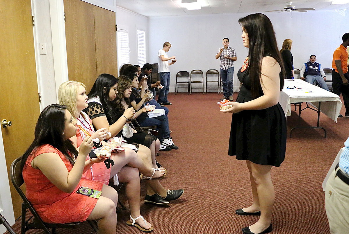 Image: Paige Westbrook chats with friends while enjoying ice cream.