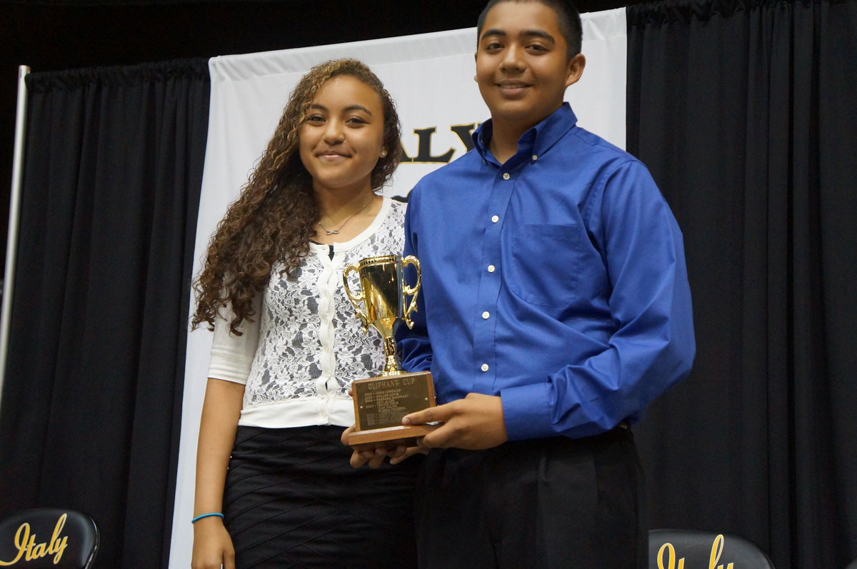 Image: Chris Munoz is the 2014 recipient of the Margaret Oliphant Cup, presented by Vanessa Cantu, 2013 recipient.