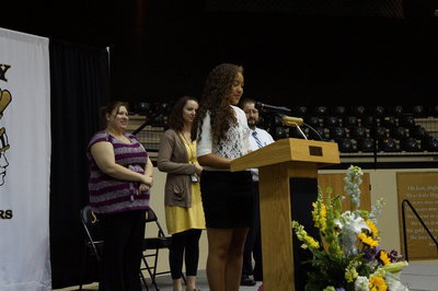 Image: Vanessa Cantu announces 2014 Margaret Oliphant Cup to the Italy Junior High Assembly.