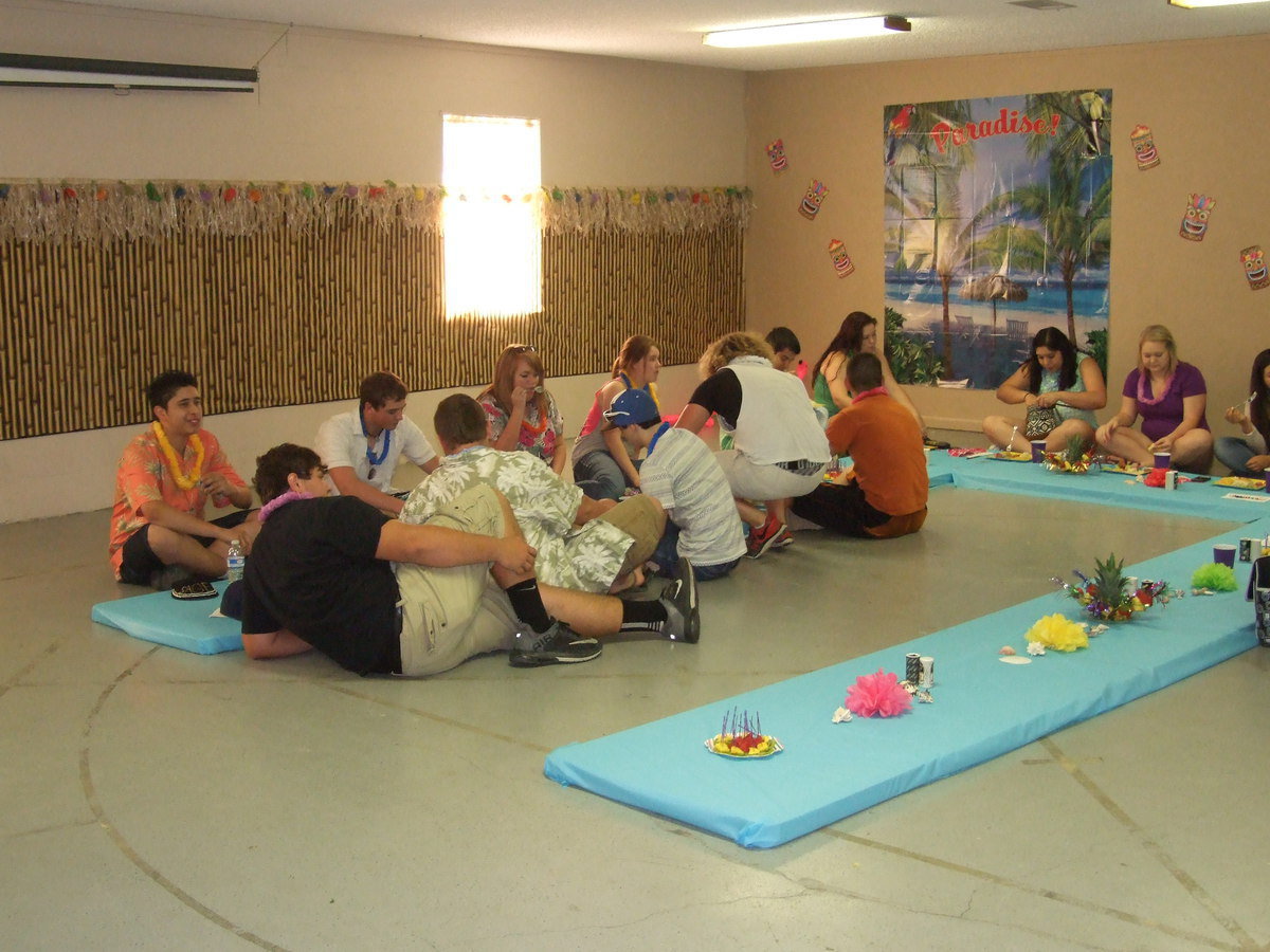 Image: Some of the guys have a hard time eating cross-legged on the floor, so they improvise and just lay down.