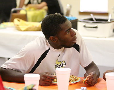 Image: TaMarcus Sheppard enjoys talking with his table mates while enjoying the fiesta of food.