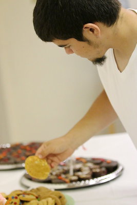 Image: Tyler Anderson samples the cookie tray.