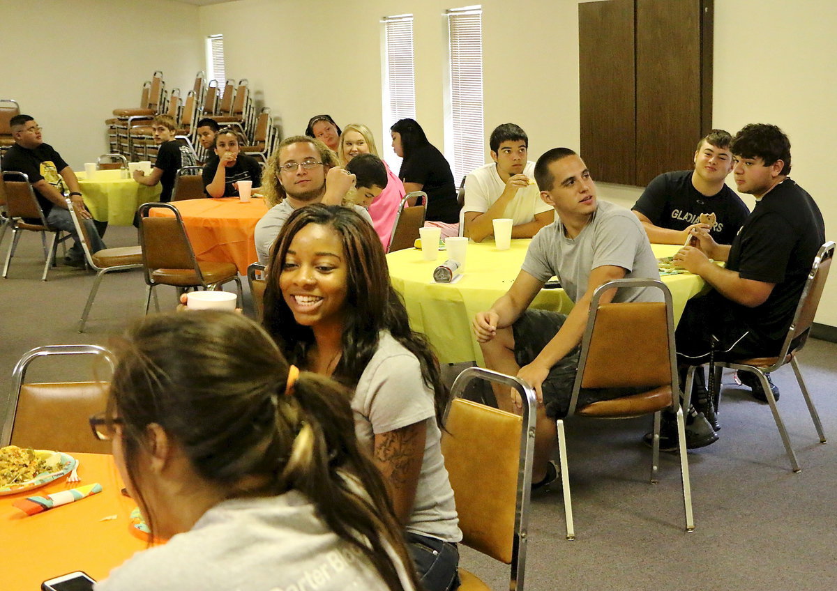 Image: Adrianna Celis, Bernice Hailey and the rest of the graduates are having fun mingling and socializing during the survival game.