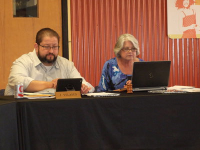 Image: Mr. Velasco and Cheryl Owen get prepared for the meeting.