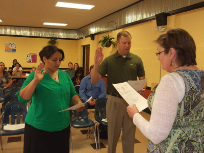 Image: Tessa South and Larry Creighton take the official oath of the Italy School Board.