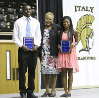 Image: On behalf of NFL great Keith Davis and his family, Elmerine Bell presents the Keith Davis Most Outstanding Male and Female Athlete Awards to TaMarcus Sheppard and Kendra Copeland during the 2013-2014 Italy Athletic Banquet.