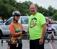 Image: City of Italy’s mayor, James Hobbs, welcomes a cyclist from Tyler to our fair city for the 29th Annual 2014 Tour d’Italia Bicycle race that set an event record with 1,175 cyclists participating from around the country.