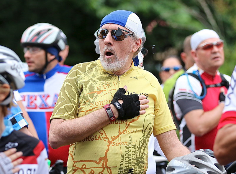 Image: This rider volunteers his vocal services during the playing of the pre-ride anthem.