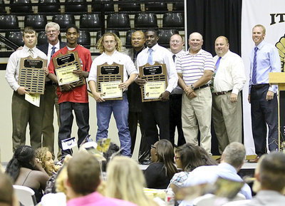 Image: On the back row, Athletic Director/Head Football Coach Charles Tindol, Bobby Campbell, Brandon Ganske, Wayne Rowe and Jon Cady stand with Gladiator Football’s top award winners. Zain Byers received the Jimmy Davis Fighting Heart Award, Trevon Robertson was the Offensive MVP, Shad Newman was the Defensive MVP and TaMarcus Sheppard received the team’s Overall MVP.