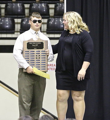 Image: A co-MVP as a junior, senior Zain Byers livens things up while accepting his Tennis MVP award from Head Coach Melissa Fullmer.