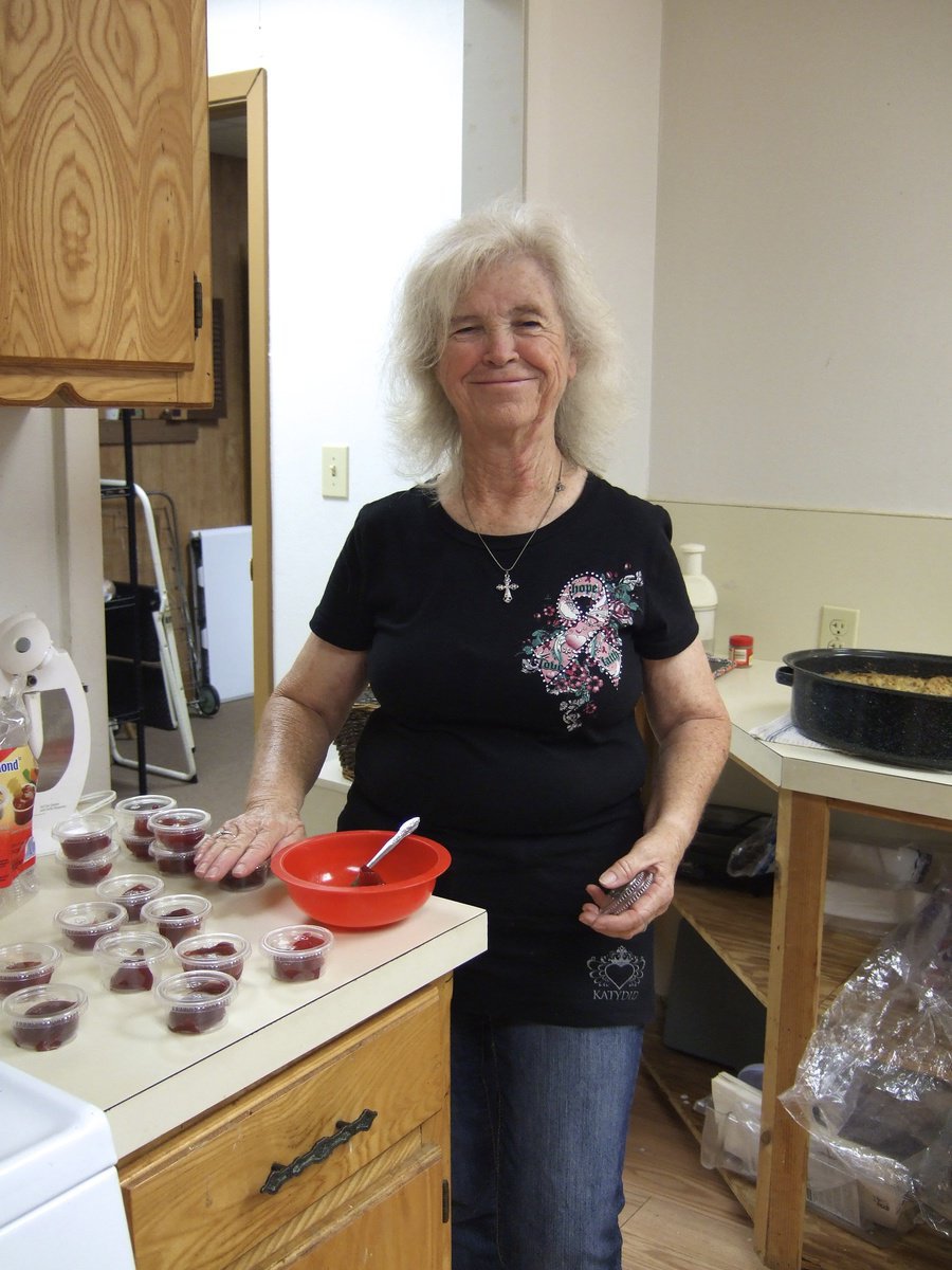 Image: Anita Tune (volunteer) helping prepare lunch.