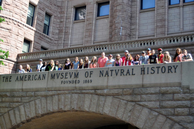 Image: IHS band students take time to pose for a group pic before entering the American Museum of Natural History.