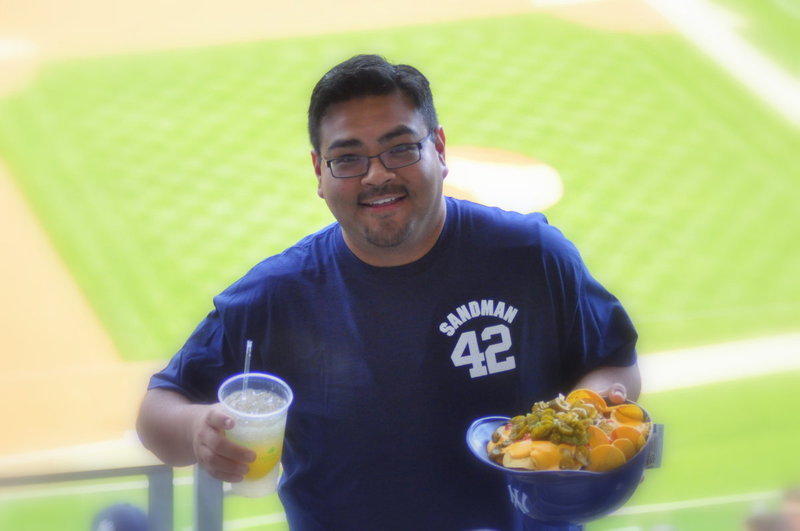 Image: Mr Perez gets a small order of nachos at Yankee Stadium.